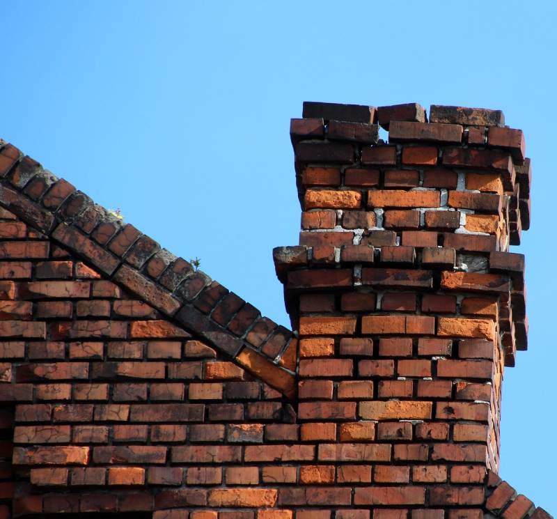 Signs Your Fountain Valley Home Needs a Chimney Inspection Damaged chimney on an Fountain Valley home showing cracks and missing mortar
